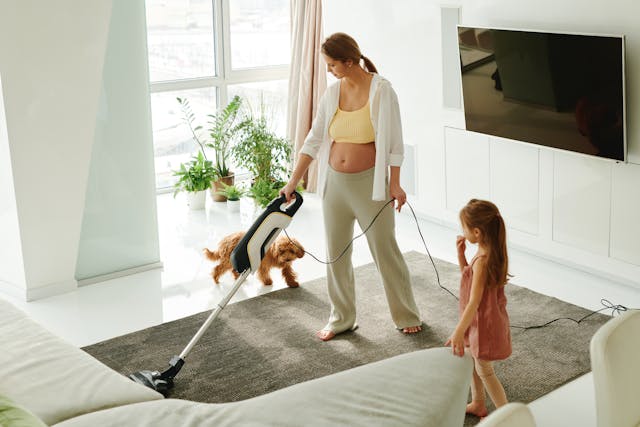 a-woman-using-a-vacuum